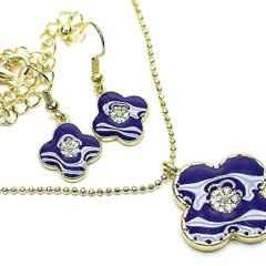 Elegant guldpläterad smyckeset med kristaller och lila färgad enamel blomma